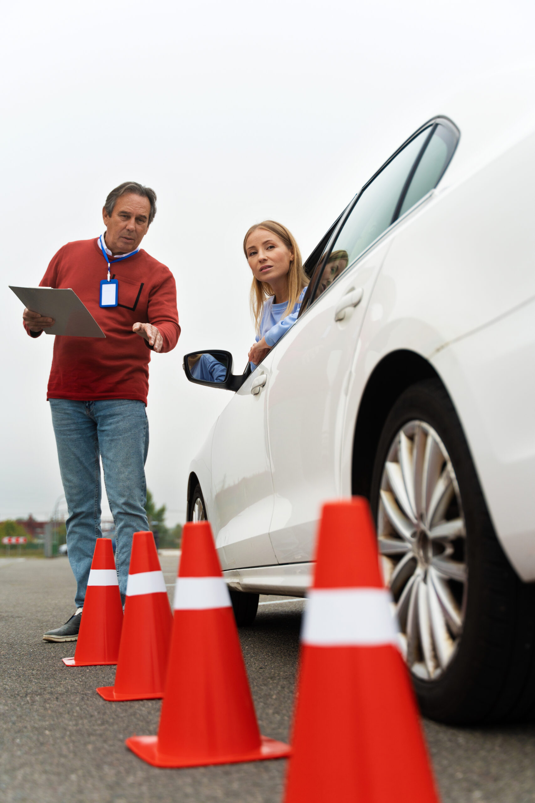 Student taking driving exam with instructor